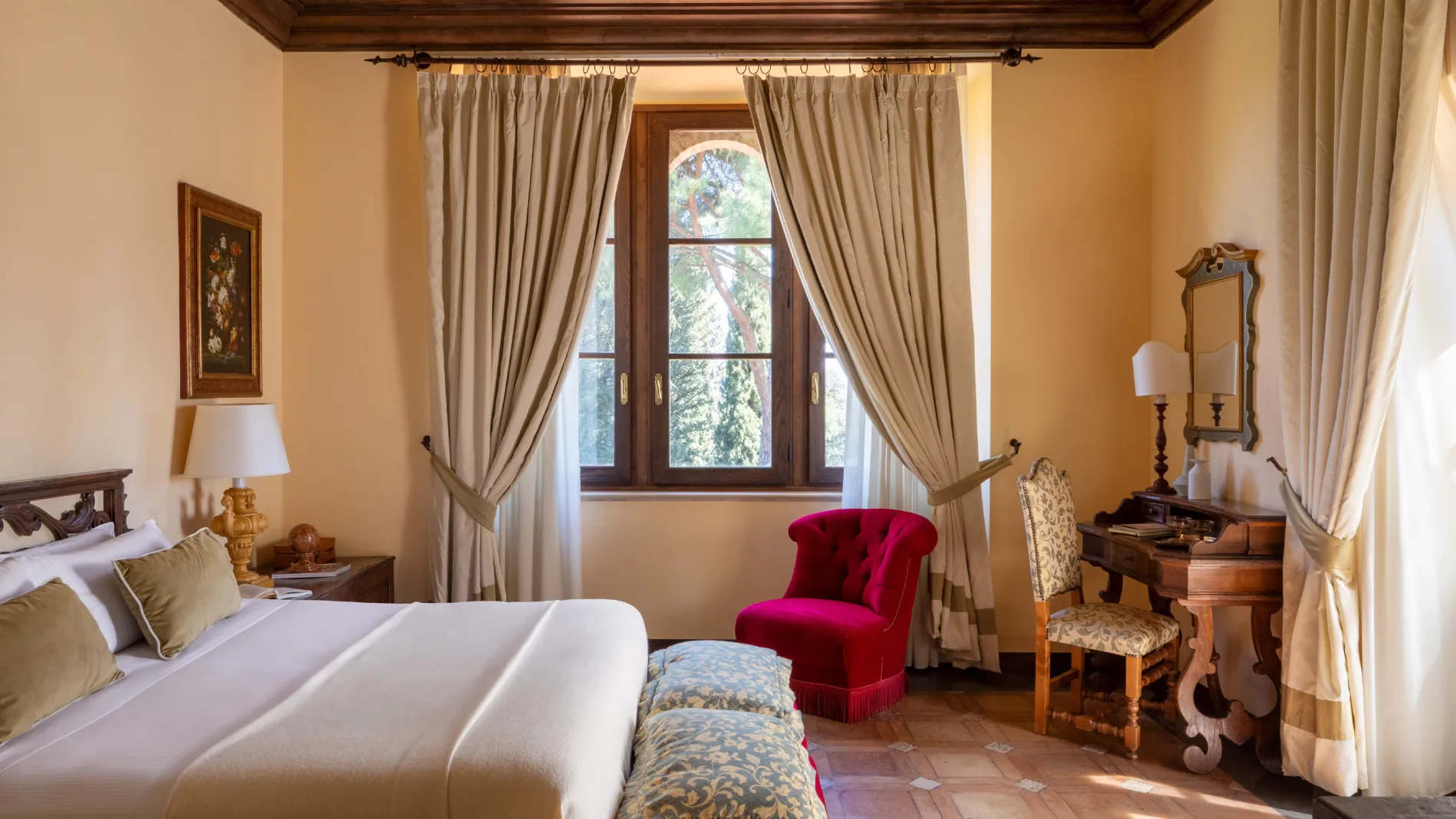 Charming room with double bed, classic writing desk and red armchair in Tuscan style - La Collegiata, BZAR hotels in Tuscany